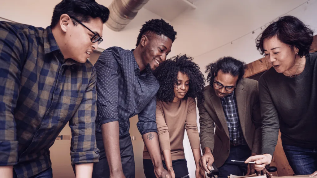 Outsourced technical support services being discussed by a management team