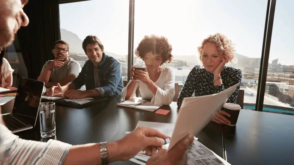 Executives in a meeting discussing payment recovery process and how to collect payments better and retain customers