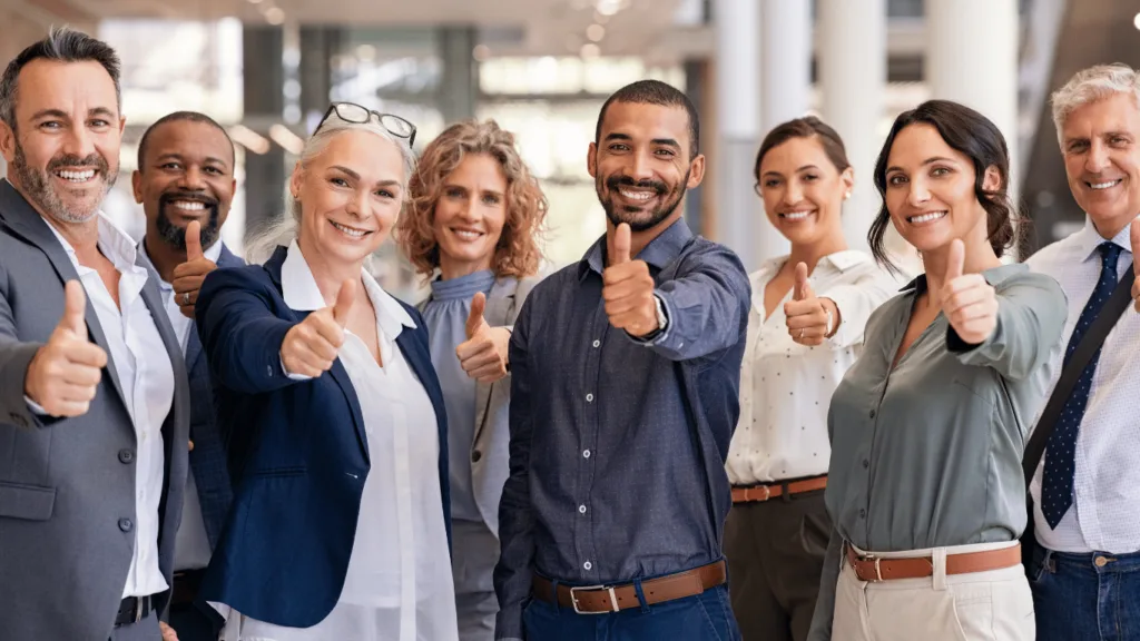 Customer experience team with thumbs up illustrating success