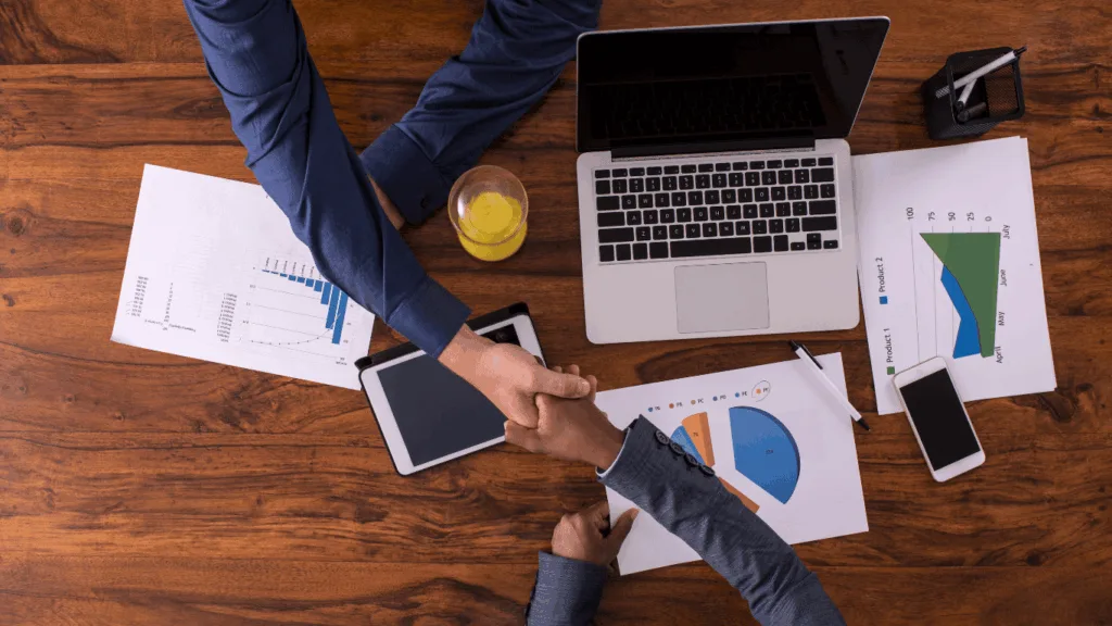 Business owner shaking hands with BPO services representative